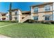 Two-story exterior with well-manicured lawn and inviting entryway, great for curb appeal at 1030 Villagio Cir # 103, Sarasota, FL 34237