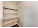 Efficient office nook with built in desk and shelving, perfect for remote work at 1030 Villagio Cir # 103, Sarasota, FL 34237