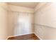 Empty walk-in closet features wood-look floor and wire shelving at 1030 Villagio Cir # 103, Sarasota, FL 34237