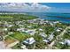Aerial view highlighting the property's proximity to waterways and lush surroundings at 12107 45Th W Ave, Cortez, FL 34215