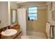 Charming bathroom with a shower and tub combo, seashell decor, and natural light at 12107 45Th W Ave, Cortez, FL 34215