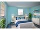 Cozy bedroom with a white bed and soft blue walls at 12107 45Th W Ave, Cortez, FL 34215