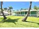 Inviting single story home featuring a spacious lawn and charming porch at 12107 45Th W Ave, Cortez, FL 34215