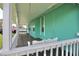 Inviting porch with a charming white swing, perfect for relaxing outdoors at 12107 45Th W Ave, Cortez, FL 34215