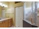 Bright bathroom featuring neutral vanity, large mirror and a glass shower at 1245 Millbrook Cir, Bradenton, FL 34212