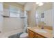 Standard bathroom with tile flooring, large vanity and shower-tub combo at 1245 Millbrook Cir, Bradenton, FL 34212