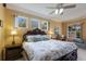 Spacious main bedroom with a ceiling fan, natural light and a desk perfect for working at 1245 Millbrook Cir, Bradenton, FL 34212