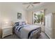 Guest bedroom with natural light, ceiling fan and white furniture at 1245 Millbrook Cir, Bradenton, FL 34212