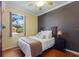 Comfortable bedroom with hardwood floors, a ceiling fan, a bed and a window at 1245 Millbrook Cir, Bradenton, FL 34212