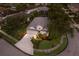 Charming single-story home featuring manicured landscaping, inviting entrance, and a spacious driveway leading to a two-car garage at 1245 Millbrook Cir, Bradenton, FL 34212