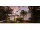 Well-maintained two-story home featuring lush landscaping, a neutral stucco exterior, and a two-car garage at 1245 Millbrook Cir, Bradenton, FL 34212