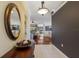 Inviting foyer with beautiful floors, a decorative mirror, and a view into the dining room and living room at 1245 Millbrook Cir, Bradenton, FL 34212