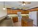 Bright kitchen with wooden cabinetry, plenty of counter space and an island at 1245 Millbrook Cir, Bradenton, FL 34212