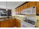 Bright kitchen featuring stainless steel appliances, wooden cabinetry and modern fixtures at 1245 Millbrook Cir, Bradenton, FL 34212