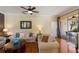 Comfortable living room with ceiling fan and sliding glass doors to the outdoor area at 1245 Millbrook Cir, Bradenton, FL 34212