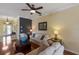 Inviting living room featuring hardwood floors, ceiling fan and comfortable seating at 1245 Millbrook Cir, Bradenton, FL 34212