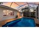Sparkling in-ground pool with a screened enclosure and adjacent to the home at 1245 Millbrook Cir, Bradenton, FL 34212