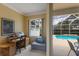 Cozy study with pool view, desk and comfortable seating at 1245 Millbrook Cir, Bradenton, FL 34212