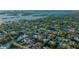 Luxurious homes in a waterfront neighborhood with mature trees are featured in this aerial shot at 1530 Pine Bay Dr, Sarasota, FL 34231
