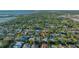 Aerial view of luxurious homes nestled among lush, mature trees in a beautiful waterfront neighborhood at 1530 Pine Bay Dr, Sarasota, FL 34231