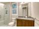 This bathroom has granite counters, a glass enclosed shower, and luxury finishes at 1530 Pine Bay Dr, Sarasota, FL 34231