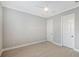 Neutral-toned bedroom with hardwood floors, a modern ceiling fan, and access to two doors at 1530 Pine Bay Dr, Sarasota, FL 34231
