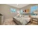 Bedroom decorated in neutral colors and nautical décor, features lots of natural light at 1530 Pine Bay Dr, Sarasota, FL 34231