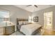 This bedroom features neutral tones, a patterned rug, and plenty of natural light at 1530 Pine Bay Dr, Sarasota, FL 34231