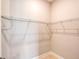 Empty walk-in closet features white walls and wire shelving for ample storage at 1530 Pine Bay Dr, Sarasota, FL 34231