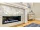 Close up of modern marble fireplace with stylish decor at 1530 Pine Bay Dr, Sarasota, FL 34231