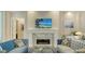 Stylish living room featuring a modern fireplace at 1530 Pine Bay Dr, Sarasota, FL 34231