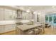 Modern kitchen features a large island, stainless steel appliances, and ample counter space at 1530 Pine Bay Dr, Sarasota, FL 34231