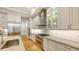 Bright kitchen with stainless steel appliances, granite countertops, and hardwood floors at 1530 Pine Bay Dr, Sarasota, FL 34231