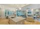 Bright open floor plan with island sink and view of the living area with fireplace at 1530 Pine Bay Dr, Sarasota, FL 34231