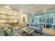 Open-concept living room with a view of the kitchen and screened-in outdoor living area at 1530 Pine Bay Dr, Sarasota, FL 34231