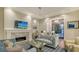 Elegant living room with a marble fireplace and comfortable seating at 1530 Pine Bay Dr, Sarasota, FL 34231