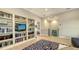 Living room featuring modern decor, built-in bookshelves, and neutral color palette at 1530 Pine Bay Dr, Sarasota, FL 34231