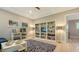 Living room featuring modern decor, built-in bookshelves, and neutral color palette at 1530 Pine Bay Dr, Sarasota, FL 34231