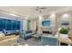Bright living room featuring a fireplace and sliding doors leading to the pool at 1530 Pine Bay Dr, Sarasota, FL 34231