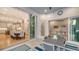 A covered patio offers ample space to dine, and is adjacent to both an office and a dining room at 1530 Pine Bay Dr, Sarasota, FL 34231