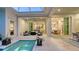 Covered outdoor patio with seamless access to both indoor and outdoor areas at 1530 Pine Bay Dr, Sarasota, FL 34231