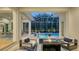 Outdoor living space with a pool, spa, and fire pit seating area at 1530 Pine Bay Dr, Sarasota, FL 34231
