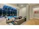 Screened-in patio with a pool, spa, and an outdoor seating area at 1530 Pine Bay Dr, Sarasota, FL 34231