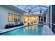 Gorgeous screened-in pool area, perfect for entertaining, with an open-concept living space at 1530 Pine Bay Dr, Sarasota, FL 34231