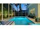 Sparkling pool with screened enclosure and spa, offering serene outdoor living at 1530 Pine Bay Dr, Sarasota, FL 34231