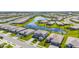 An aerial view of a neighborhood with a scenic pond, lush green landscaping, and well-maintained homes at 15336 Serene Shores Loop, Bradenton, FL 34211