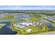 Wide aerial shot of a community with a lake, clubhouse, pool, tennis courts, and surrounding residential area at 15336 Serene Shores Loop, Bradenton, FL 34211