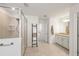 Shower and granite countertop in this neutral and bright bathroom at 15336 Serene Shores Loop, Bradenton, FL 34211