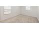 Simple and bright bedroom with natural light coming through the windows at 15336 Serene Shores Loop, Bradenton, FL 34211
