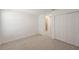 Bedroom featuring a closet with bi-fold doors and an ensuite bathroom at 15336 Serene Shores Loop, Bradenton, FL 34211
